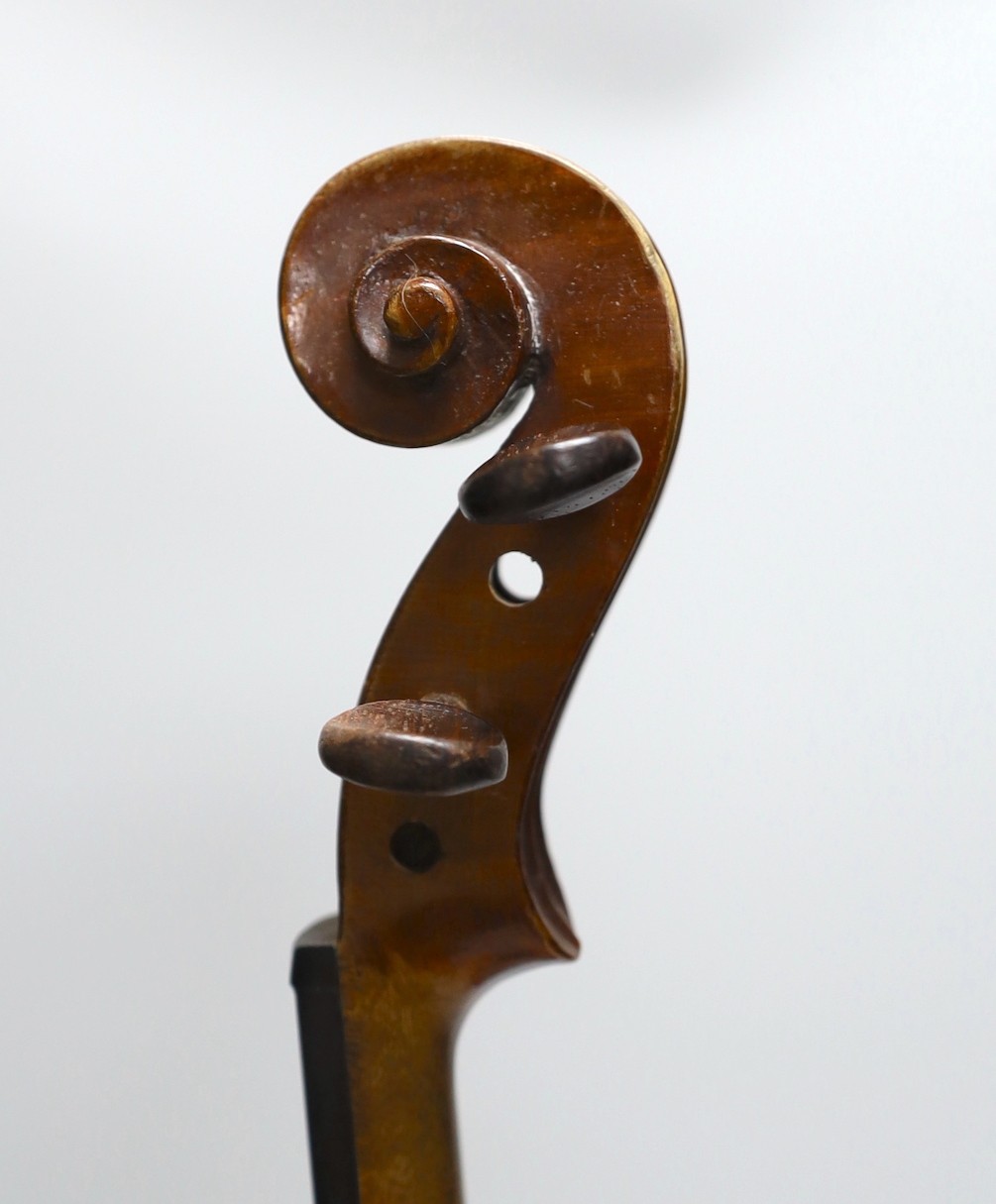 A cased three quarter size violin, labelled E.Coiffier, 56cms long